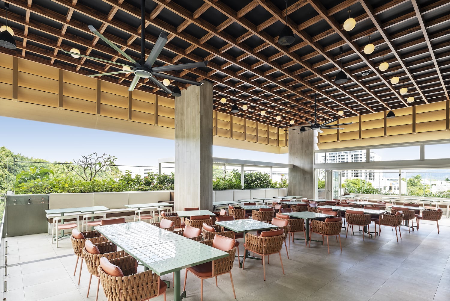 Ceiling fans installed in a modern commercial outdoor dining area