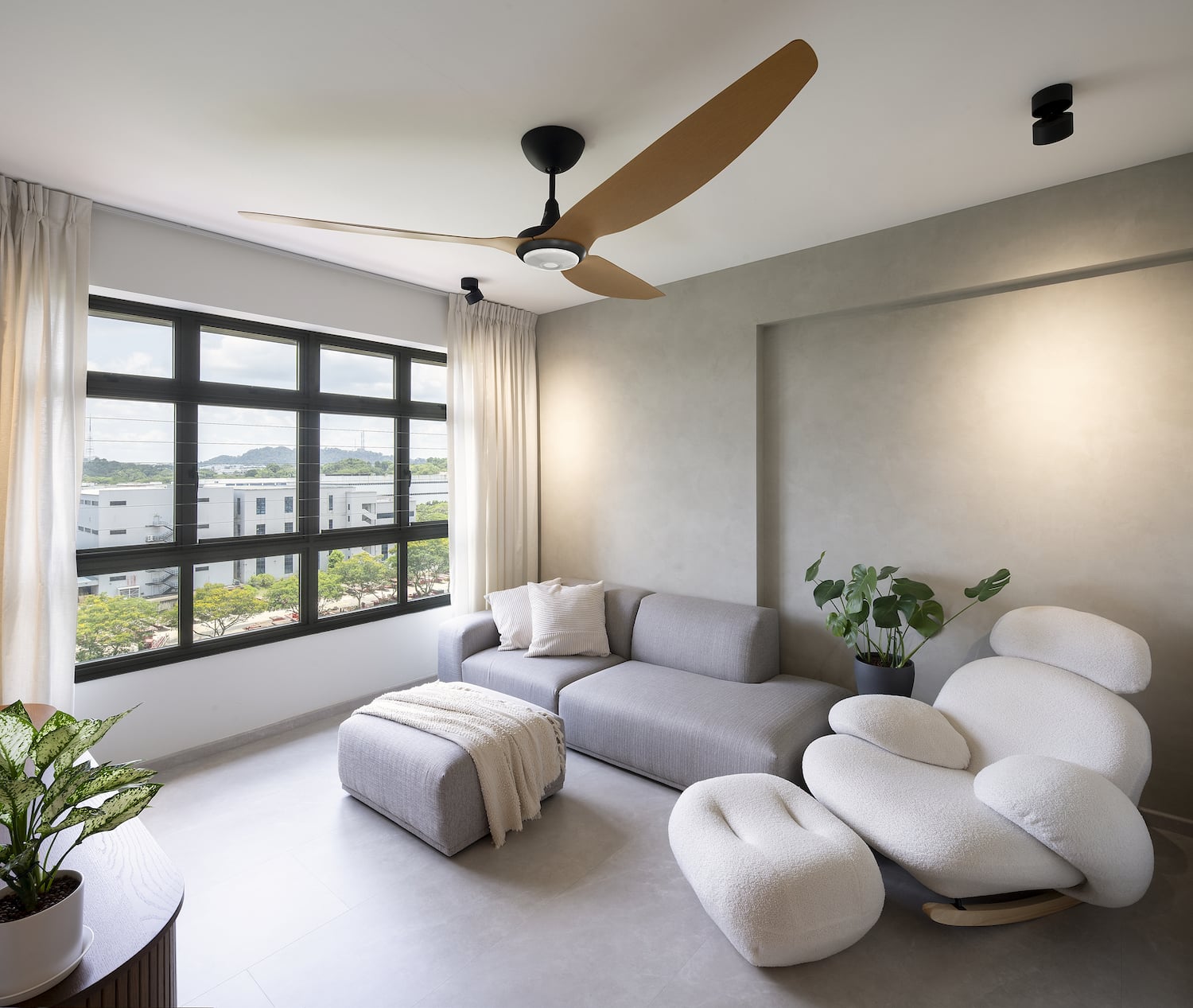 Modern living room with a large brown residential fan